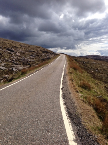 Going up Bealach-Na-Ba - ominous clouds gathering